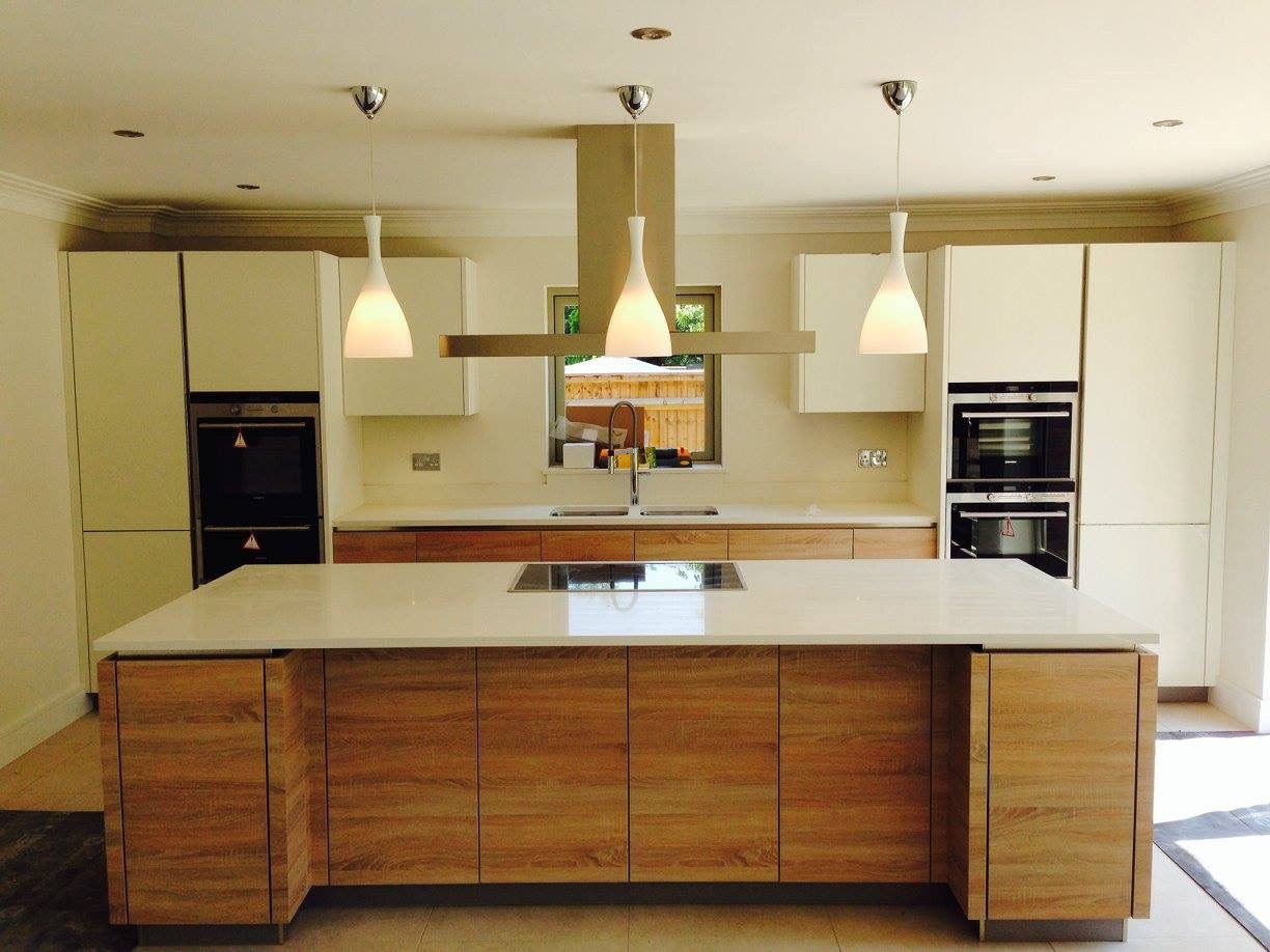 Kitchen with pendant lights over an oak island