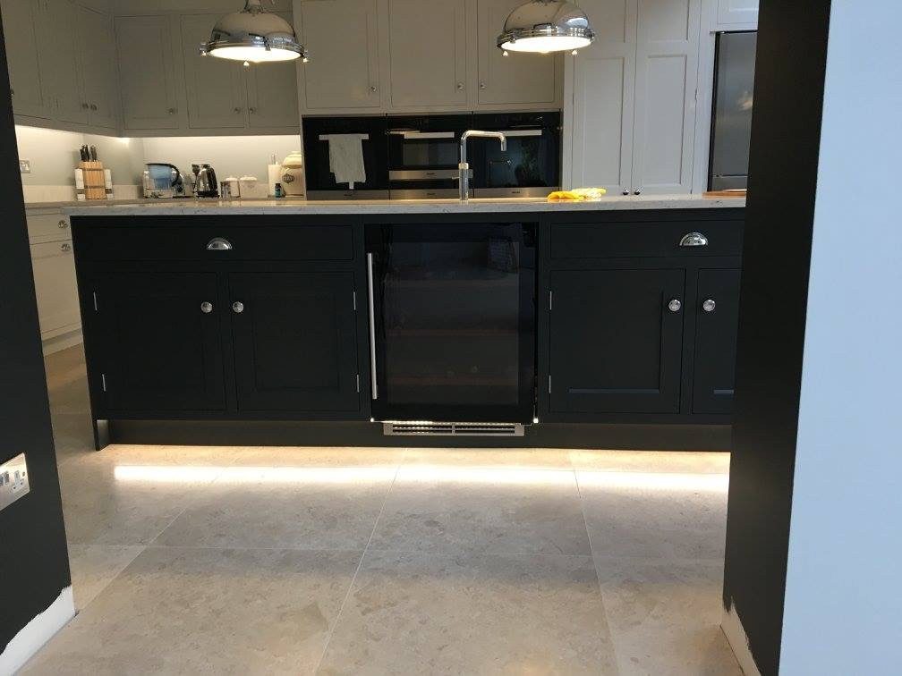 Dark kitchen units with plinth lighting